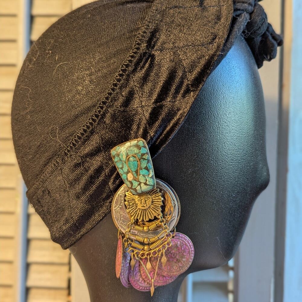Handcrafted artisanal dangling clip earrings with medallions